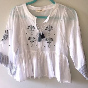 White blouse with blue detailing